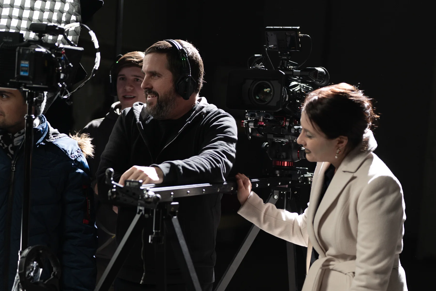 DoP setting up a tracking shot on a camera slider